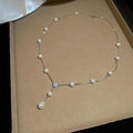 Delicate Floral Y Necklace with Pearl-Like Beads with Polished Metal Details view 6