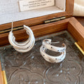Layered Silver Tone Hoop Earrings with Black Dot Details view 6