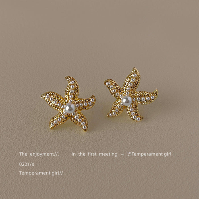Gold Tone Textured Starfish Pearl Detail Stud Earrings