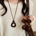 Brown Cord Necklace With Flocked Geometric Pendant view 3