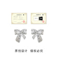 Silver Tone Crystal Pave Bow Stud Earrings Engraved Texture view 3