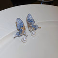 Butterfly Drop Earrings With Pearl Beads and Crystal Wings view 1