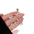 Silver Tone Bow and Pearl Chain Tassel Earrings With Decorative Details view 5