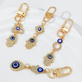 Gold-Tone Rhinestone Hamsa Hand Keychain With Evil Eye Charm view 1