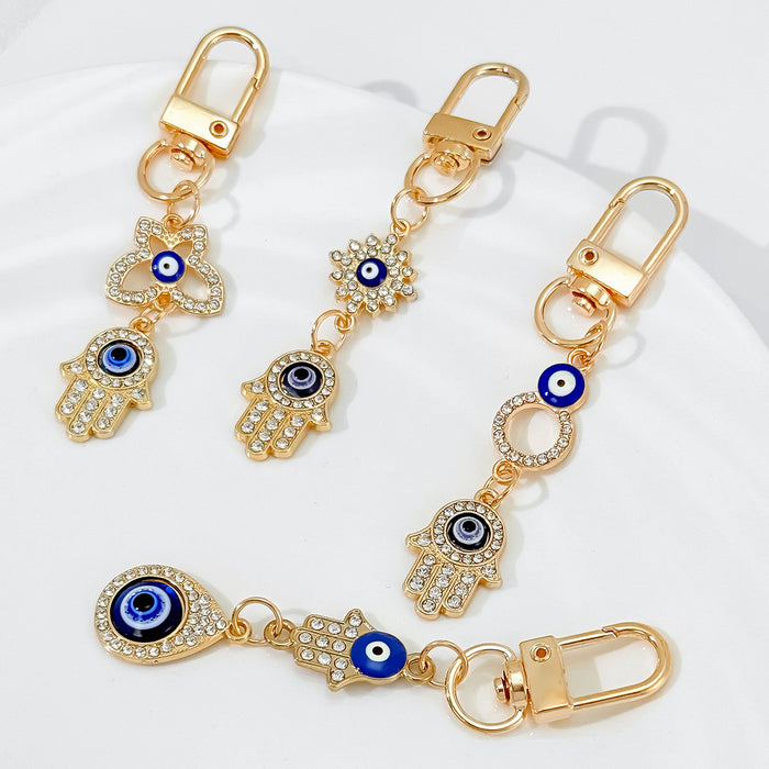 Gold-Tone Rhinestone Hamsa Hand Keychain With Evil Eye Charm