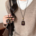 Brown Oval Resin Pendant Cord Necklace with Distinctive Textured Details view 2