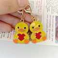 Yellow Heart-Holding Duck Lobster-Clasp Charm with Gold Tone Finish view 3