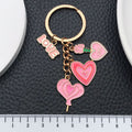 Pink Love Heart Rose and Potion Metal Keychain Set view 2