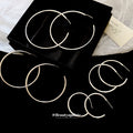 Slim Silver Round Hoop Earrings in Four Sizes with Polished Metal Details view 4