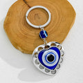 Silver Evil Eye Keychain With Butterfly Heart And Elephant Charm view 2