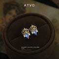 Gold Tone Aqua Iris Motif Clear Stone Stud Earrings For Women view 1