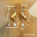 Gold Tone Hand Motif Drop Earrings Holding Pearl Drops view 4