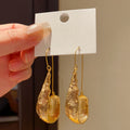 Long Faceted Resin Teardrop Earrings in Gold and Silver Tones view 4