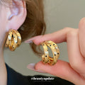 Gold Tone Triple Hoop Earrings With Black Dot Details view 4