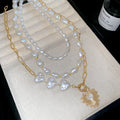 Layered Pearl And Gold Tone Heart Necklace Set With Decorative Accents view 6