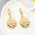 Gold Tone Ornate Evil Eye Medallion Huggie Earrings in Eight Designs view 8