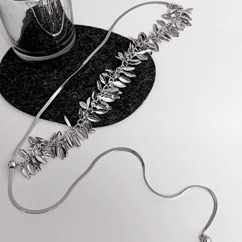 Close view of the colors and surface details on wheat leaf sequin lariat necklaces