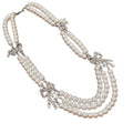 Triple Strand Faux Pearl Necklace With Crystal Bows view 5