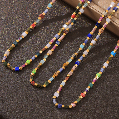 Close layout of multicolor cube beads with gold disc spacers