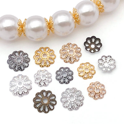 Metallic assorted shape beads arranged on a light background