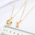 Gold Tone Artist Palette and Sweet Wrapper Pendant Necklaces view 2