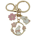Cat Charm Keychains Featuring White Flower Across 19 Pictured Variations view 11