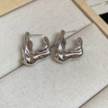 Crinkled Geometric Stud Earrings in Gold and Silver view 11