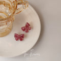 Pink Marbled Translucent Resin Bow Stud Earrings Pair view 3