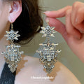 Ornate Architectural Chandelier Hook Earrings With Polished Metal Details view 1
