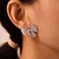 Textured Bow Stud Earrings And Bow Pendant Necklace Gold Steel view 2
