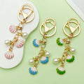 Starfish, Conch and Shell Charm Keychains Featuring Starfish, Conch Across 64 Variations view 1