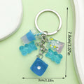 Dice Charm Keychains Featuring Black Moon Across 10 Pictured Variations view 8