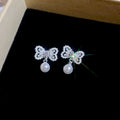 Crystal Bow Pearl Drop Stud Earrings In Gold And Silver view 7