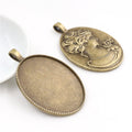Oval Cabochon Pendant Trays with Floral Relief Backs in Two Finishes view 2
