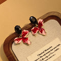Black Oval and Red White Orchid Flower Stud Earrings view 3