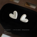 Silver Brushed Heart Stud Earrings With Raised Outline Edge view 3