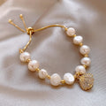 Gold Adjustable Pearl Bracelet Pavé Crystal Shell Charm view 1