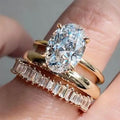 Oval Solitaire Three-Ring Set In Polished Gold Tone view 1