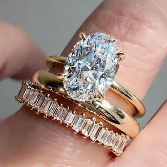 Oval Solitaire Three-Ring Set In Polished Gold Tone