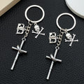 Silver Tone Cross Bat Skull and Book Keychains with Metal Hardware view 1