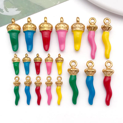 Colorful chili pepper charms arranged on a light background