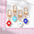 Gold Tone Enamel Hamsa Evil Eye Clip Keychains in Four Colors view 5