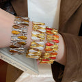 Teardrop Enamel Stretch Bracelets Gold Silver Tones view 1