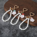 Heart Clasp Keychain With Rainbow Charm And Pearl-Like Bead Loop view 1