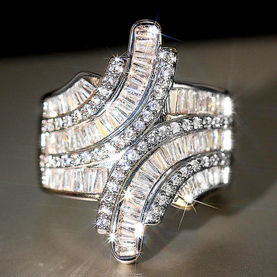 White gold geometric baguette crystal cross ring studio front view