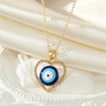 Gold Tone Crystal Open Heart Realistic Eye Pendant Necklaces view 4