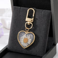 Gold Tone Pressed Daisy Heart Earrings Necklace and Clip Keychain view 4