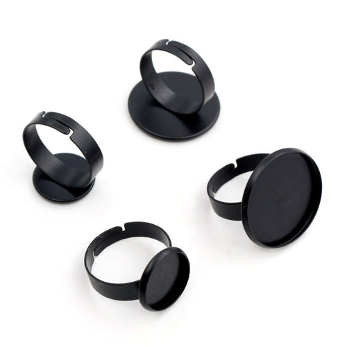 Closer view of round cabochon ring blank settings in mixed finishes showing visible finishes and shapes