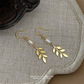 Gold Leaf Dangle Earrings White Pearl Fishhook Ear Wires view 4