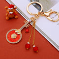Round Pipa Keychains With Crystal Flowers in Five Enamel Colors view 1